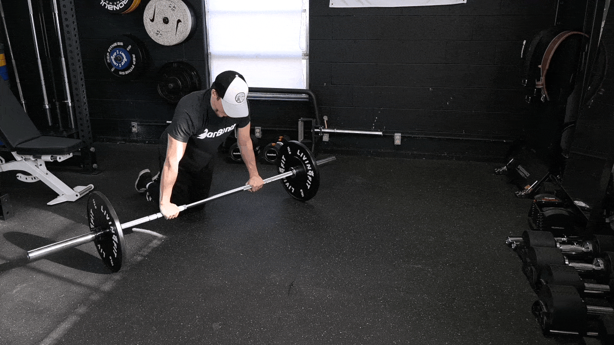 BarBend's Jake Herod performing the ab rollout exercise.