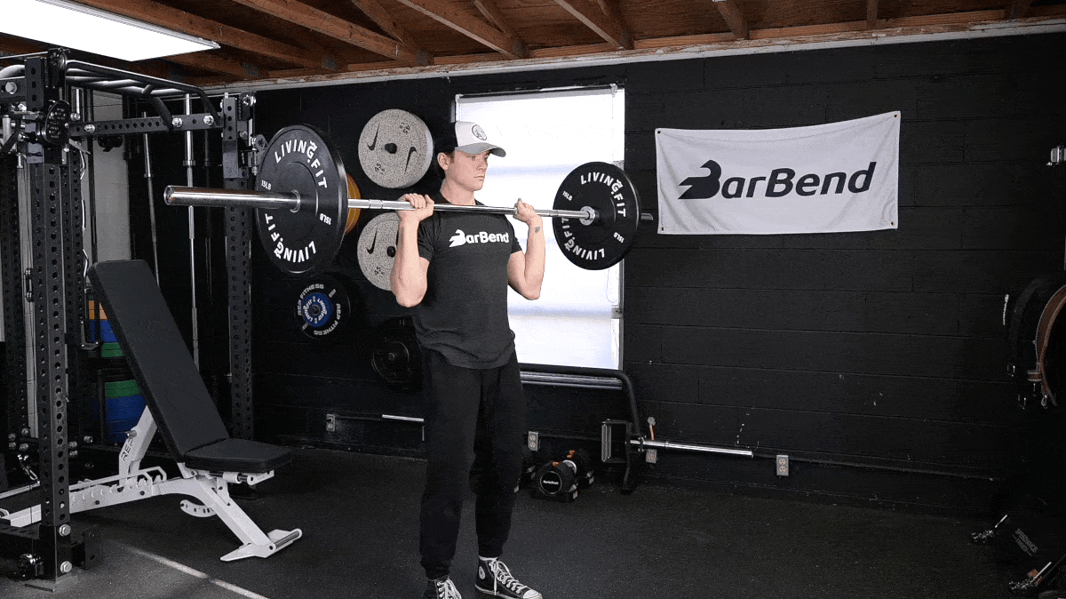 BarBend's Jake Herod performing the barbell overhead press.