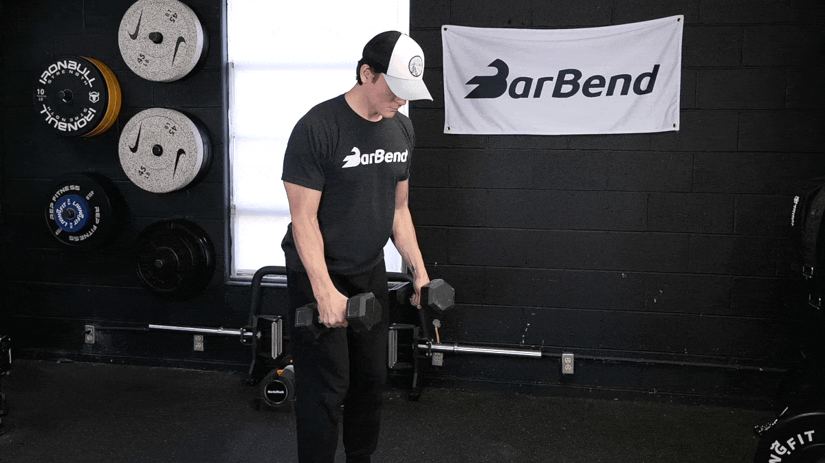 BarBend's Jake Herod performing the dumbbell lateral raise exercise.