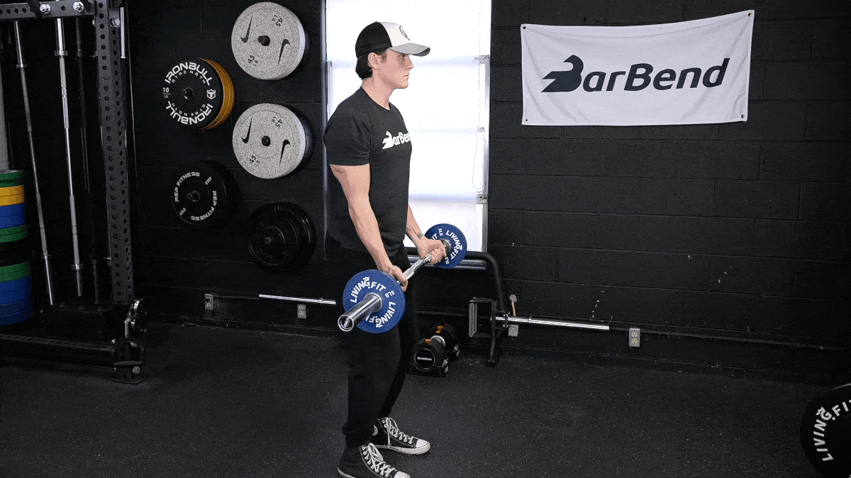 BarBend's Jake Herod performing the EZ-bar curl, one of the best biceps exercises.