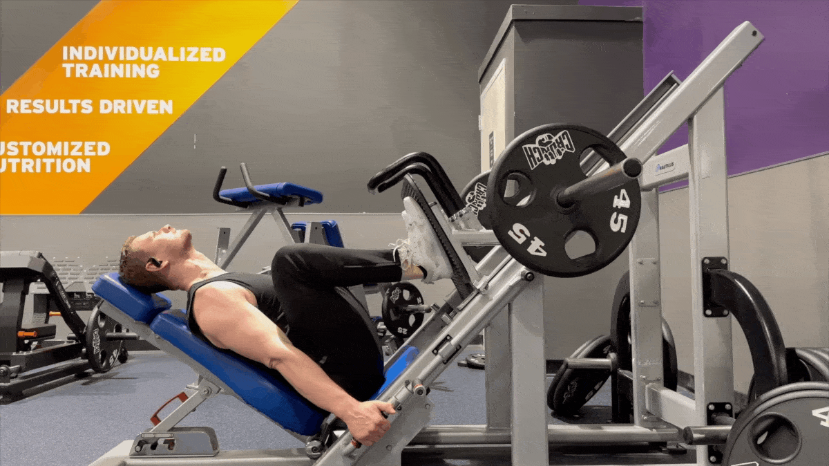 A person doing the leg press exercise.