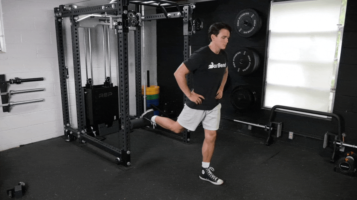 BarBend's Jake Herod performing the bulgarian split squat exercise.