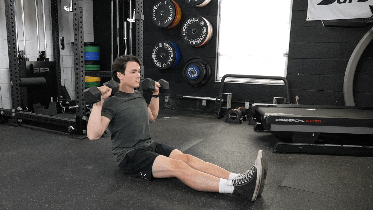 BarBend's Jake Herod performing the z press exercise.