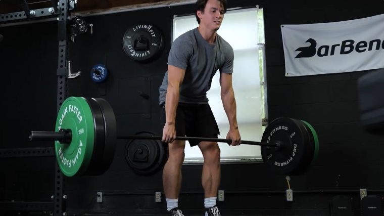 BarBend's Jake Herod deadlifting with the hades deadlift bar.
