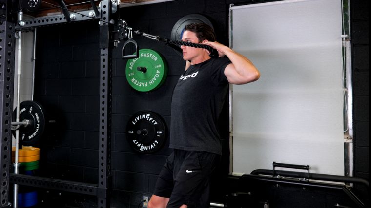 BarBend's Jake Herod performing face pulls in the Barbend gym.