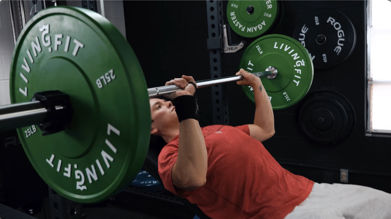 Jake doing an Incline Bench Press with the Living.Fit Weight Plates