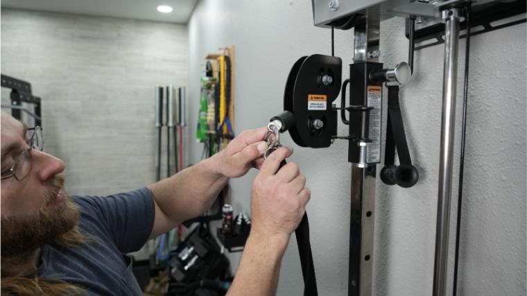 Our tester switching the handle on the Torque Fitness Anker 7.